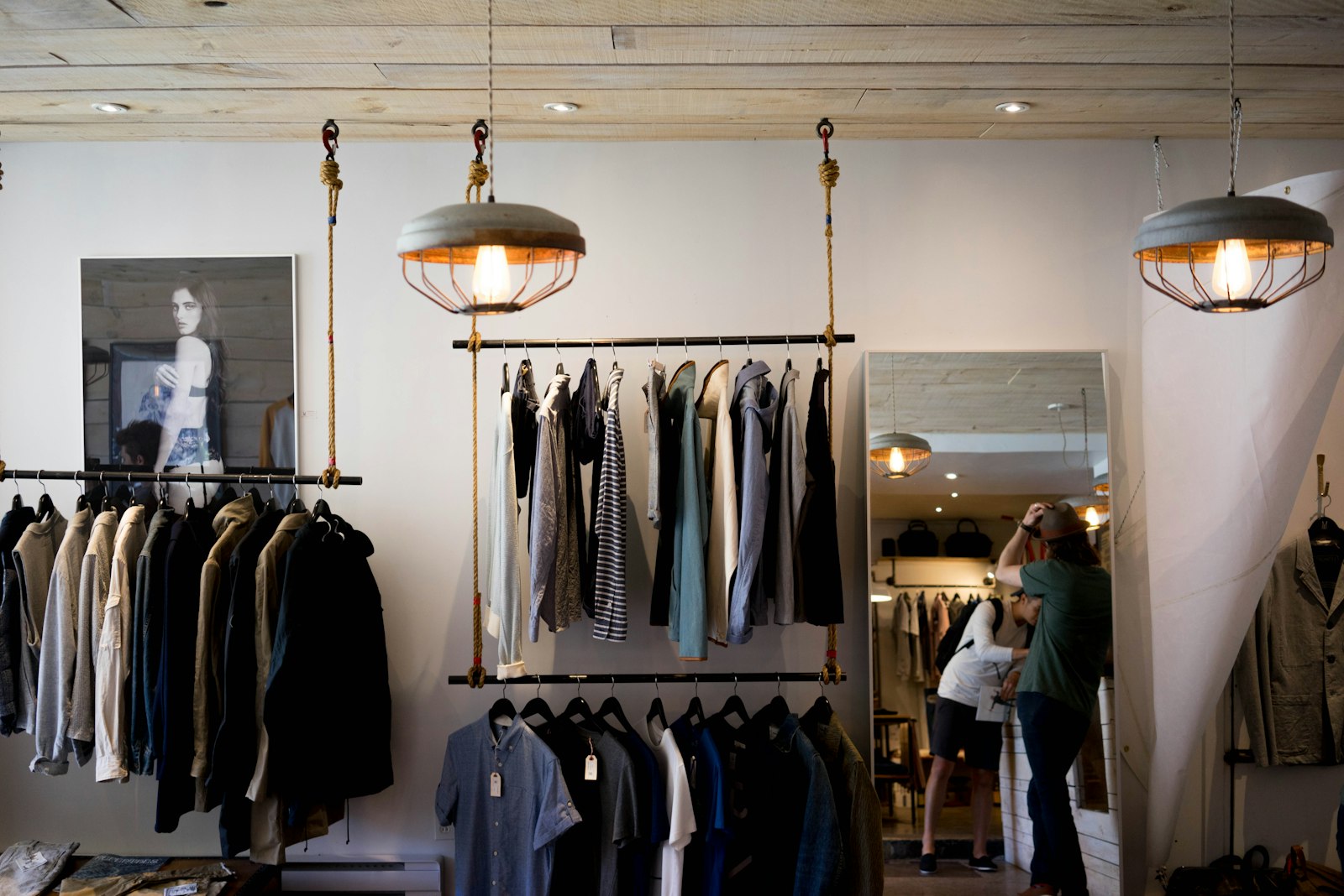 Fashion boutique clothing racks in a Shopify retail brand store